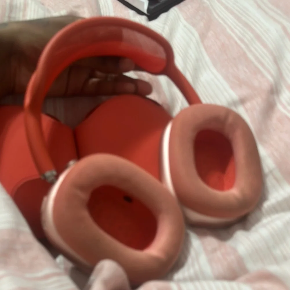 Apple AirPods Max in Red. They’re in excellent/good condition.